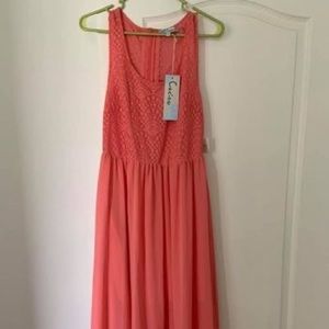 Coral dress, never worn! Flowing bottom with a matching color lining.